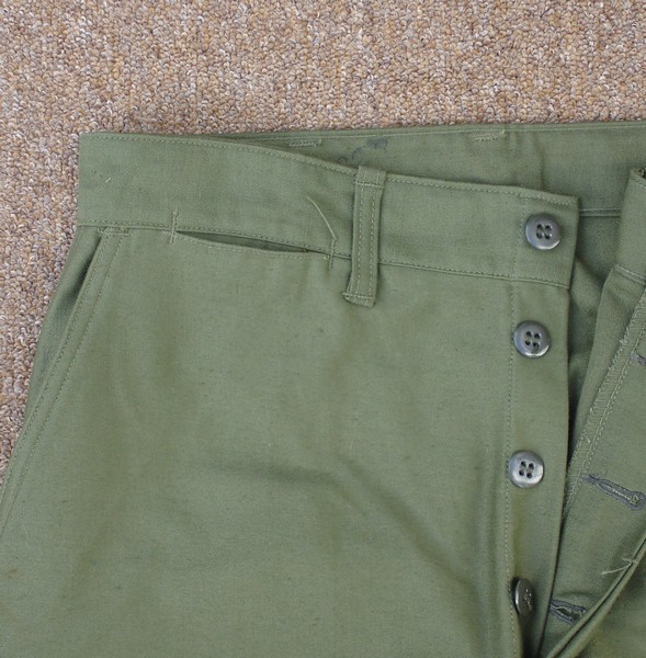 The Marine Corps P56 Utility Trousers had a watch pocket below the right waist band.